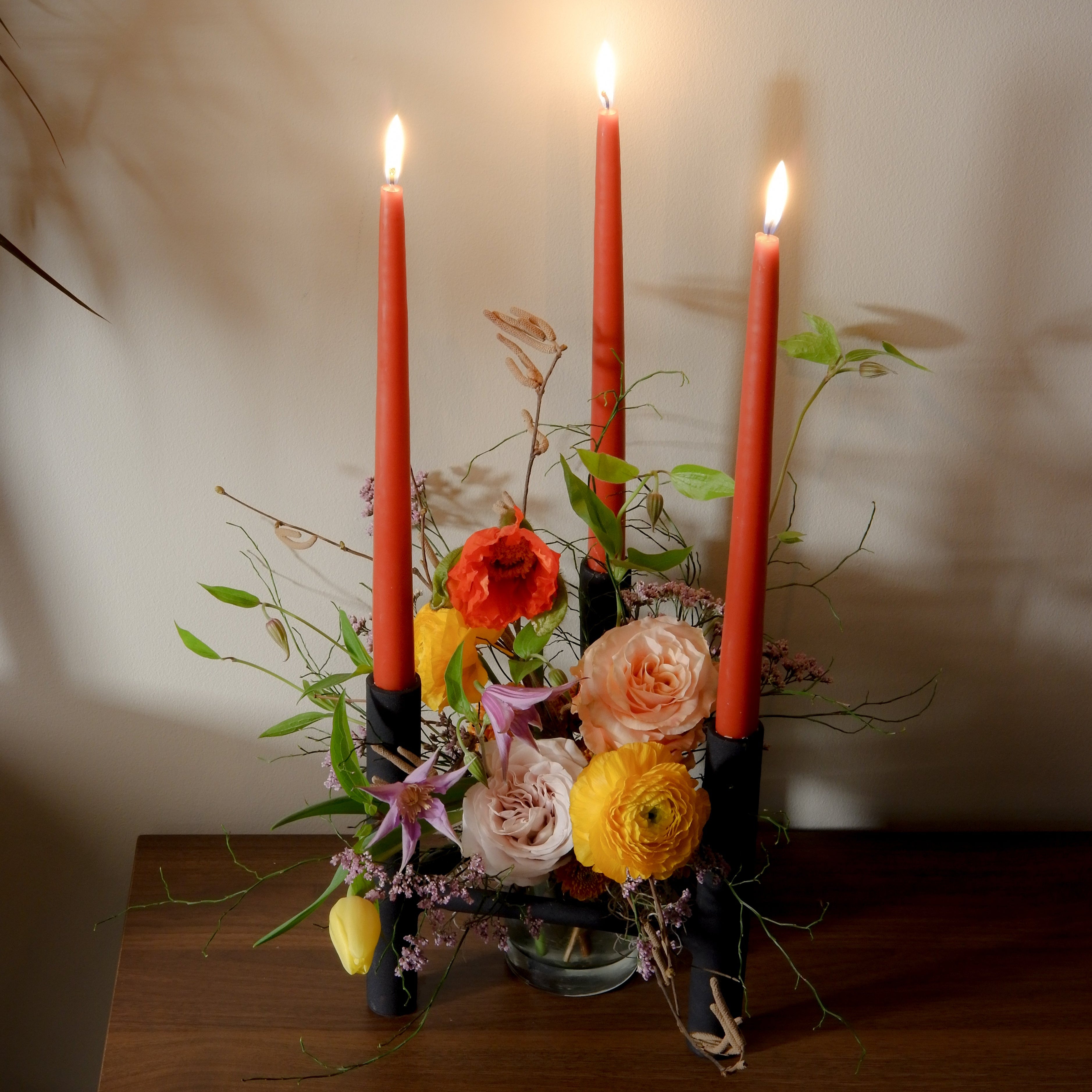 Seasonal flower arrangement with black candle holders Toronto florist Hunt & Gather