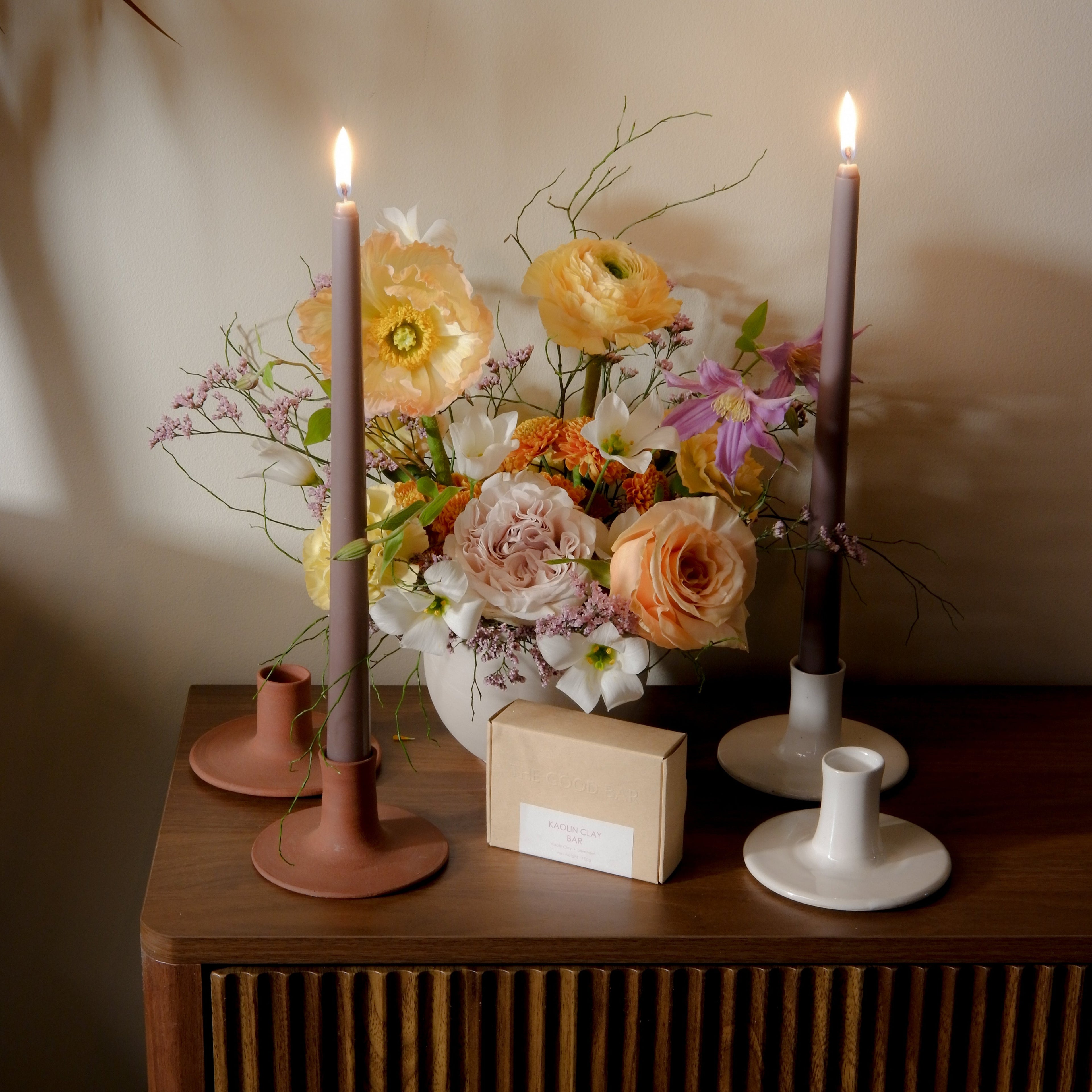 Seasonal flower arrangement with taper candles and ceramic taper holders Toronto Hunt & Gather