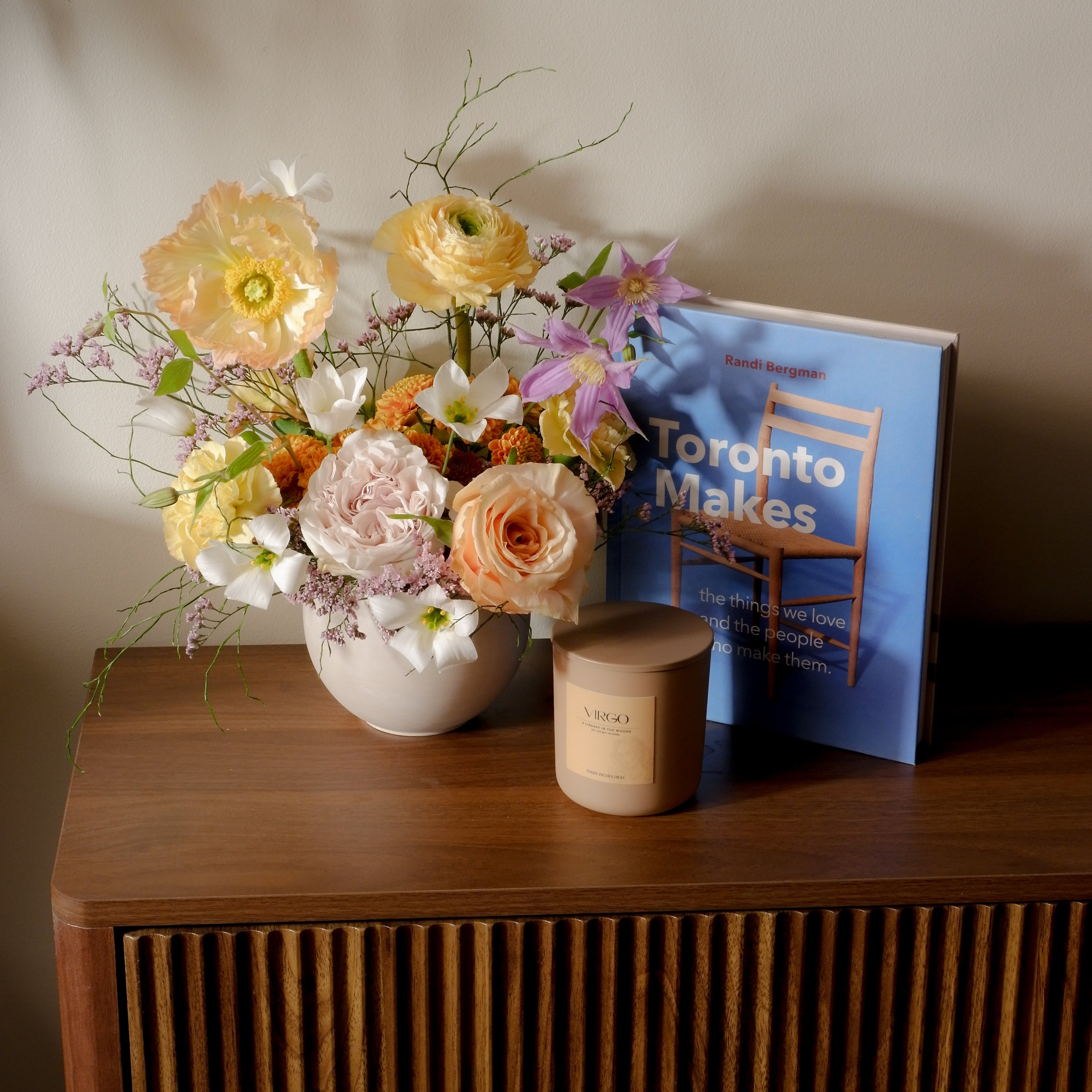 Seasonal flower arrangement with book and objects Toronto Hunt & Gather