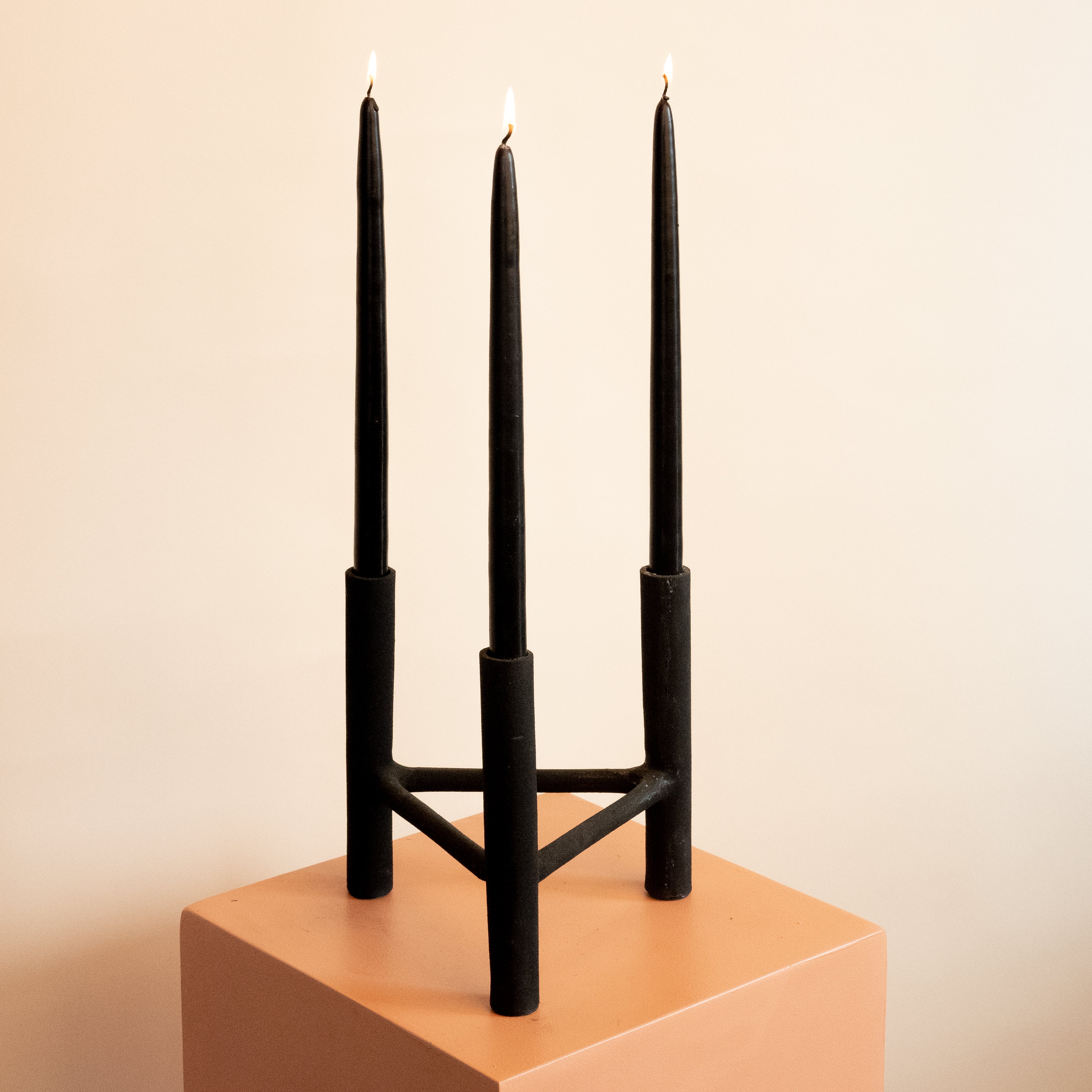 Black candle holder with taper candles by Toronto home decor brand Hunt & Gather